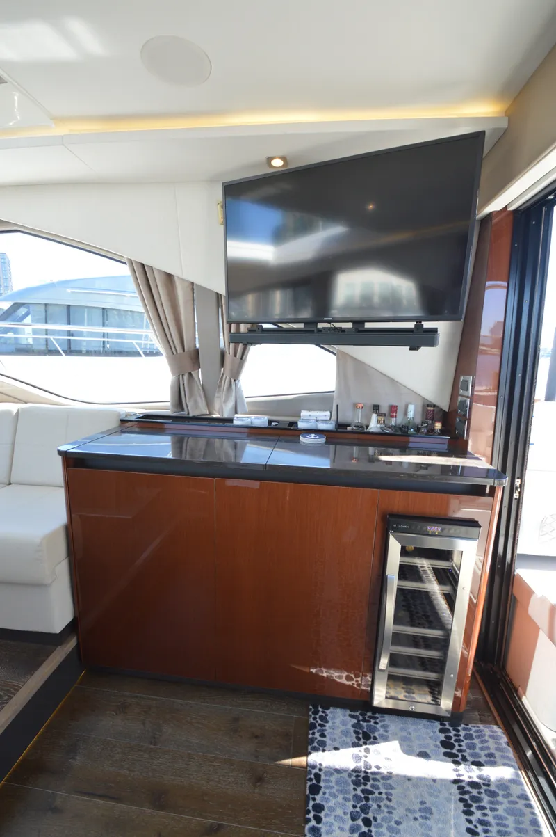 Slide: The Image of Interior of a Sea Ray 460 Express Cruiser with TV and minibar. - 28