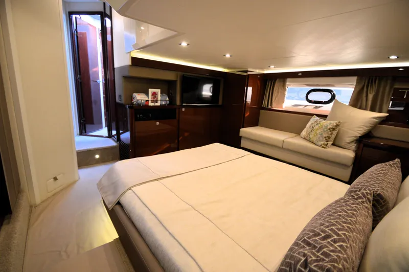 Slide: The Image of Luxurious cabin with double bed, sofa, and window. Elegant wood interior and modern lighting. - 38