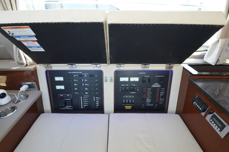 Slide: The Image of The image shows the control panel of a 2018 Sea Ray 460 Express Cruiser with various controls and displays. - 25