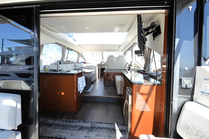 Slide: The Image of Interior view of a luxury yacht with sleek kitchen and comfortable seating areas. - 17