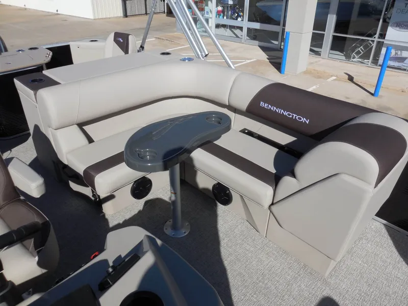 Slide: The Image of The image shows a luxurious seating area on a Bennington 22 SF Tri Toon boat. - 16