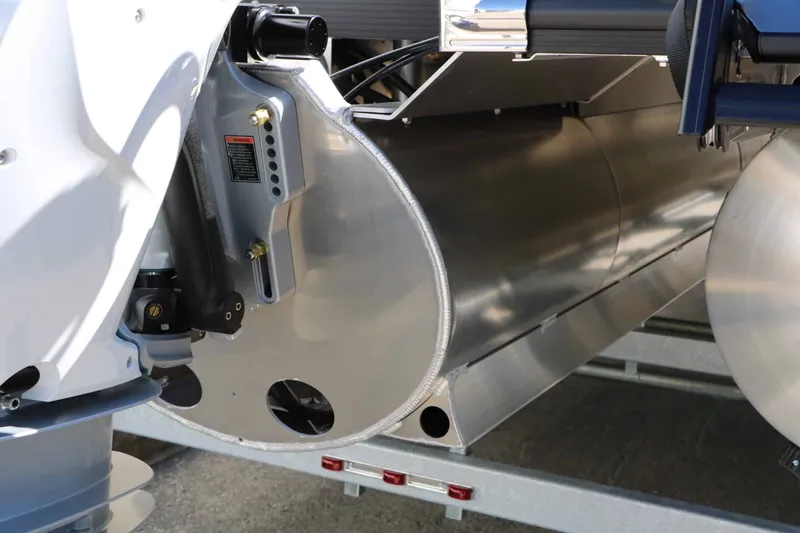 Slide: The Image of Close-up of a 2027 Bennington 25 QSBA Tri Toon on a trailer. - 25