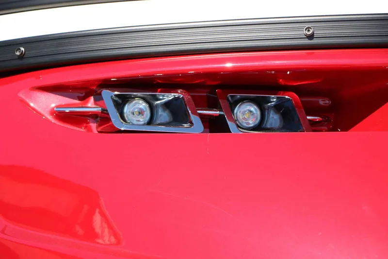 Slide: The Image of Close-up of two modern headlights on a red boat. - 15