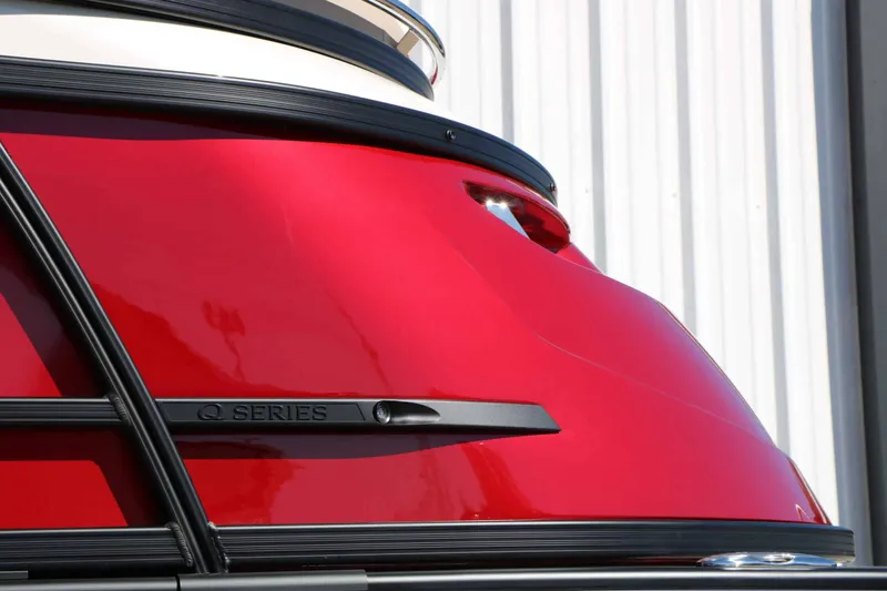 Slide: The Image of Close-up of a red 2027 Bennington 25 QSBA Tri Toon with Q Series logo. - 20