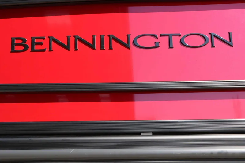 Slide: The Image of Bennington logo on a red background, possibly part of a boat. - 16