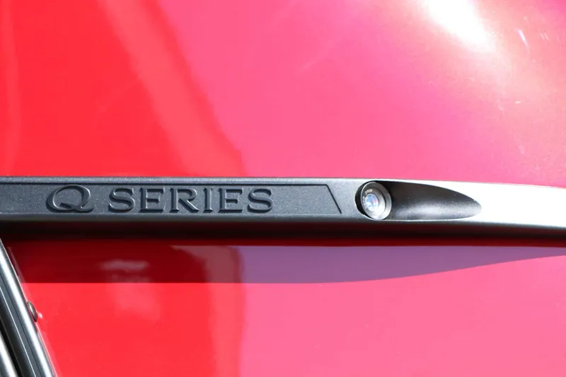Slide: The Image of Close-up of a black boat detail labeled "Q Series" on a red background. - 17