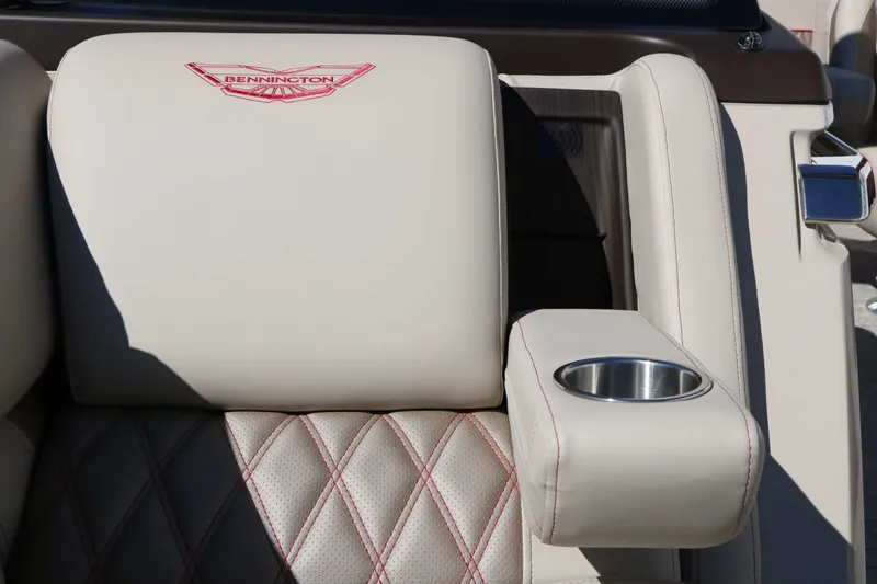 Slide: The Image of Close-up of a luxurious seat with quilted leather and a built-in cup holder. - 39