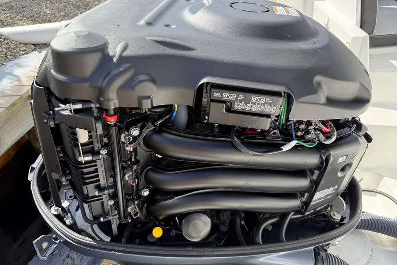 Slide: The Image of Outboard engine of 2022 Jeanneau NC 795 Series 2 boat, detailed view. - 26