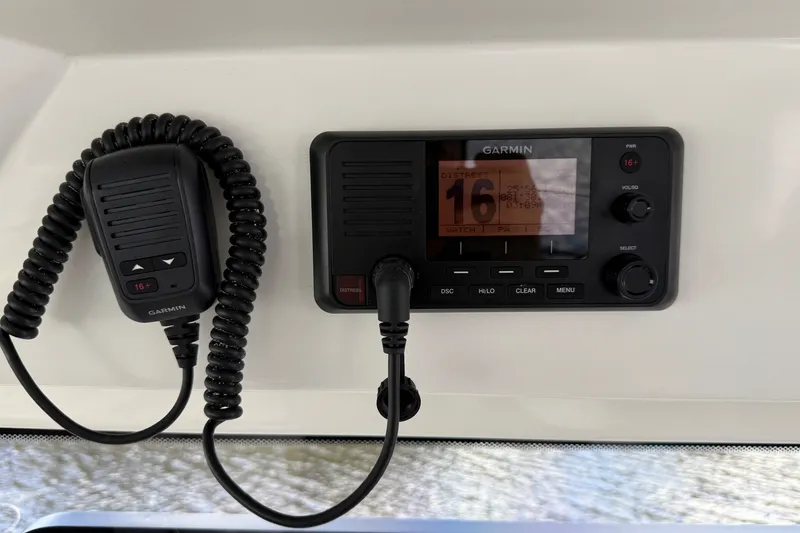 Slide: The Image of Garmin marine radio system on 2022 Jeanneau NC 795 Series 2 boat dashboard. - 14
