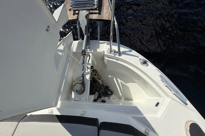 Slide: The Image of 2022 Jeanneau NC 795 Series 2 boat deck with anchor storage and ladder. - 6