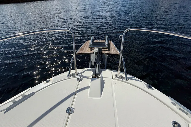 Slide: The Image of Bow view of 2022 Jeanneau NC 795 Series 2 boat on sparkling water. - 5