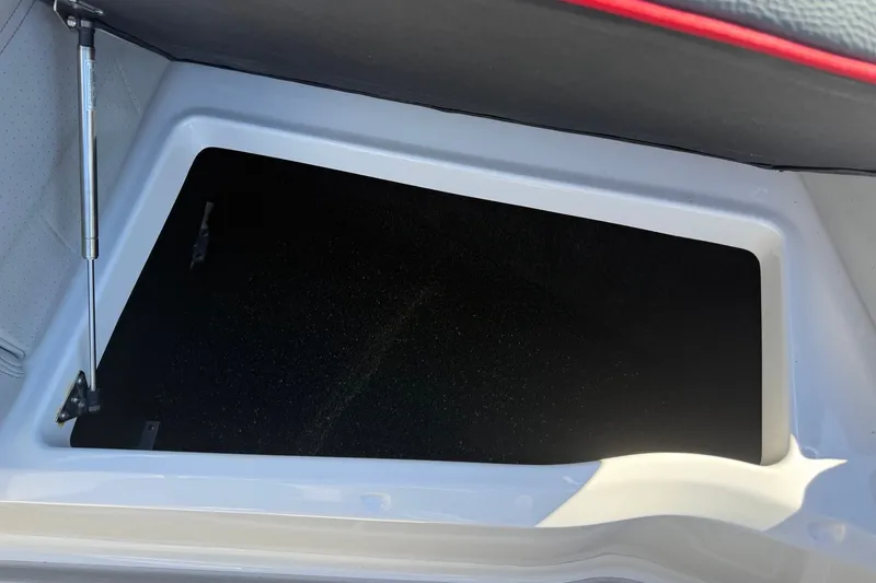 Slide: The Image of 2024 Regal LX9 storage compartment with hydraulic lift, showcasing spacious interior design. - 17