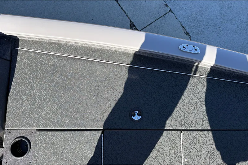 Slide: The Image of 2027 Tracker Pro Team 195 boat deck with textured surface and shadows. - 32