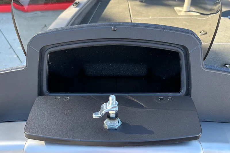 Slide: The Image of Dashboard compartment of 2027 Tracker Pro Team 195 boat with latch mechanism. - 28