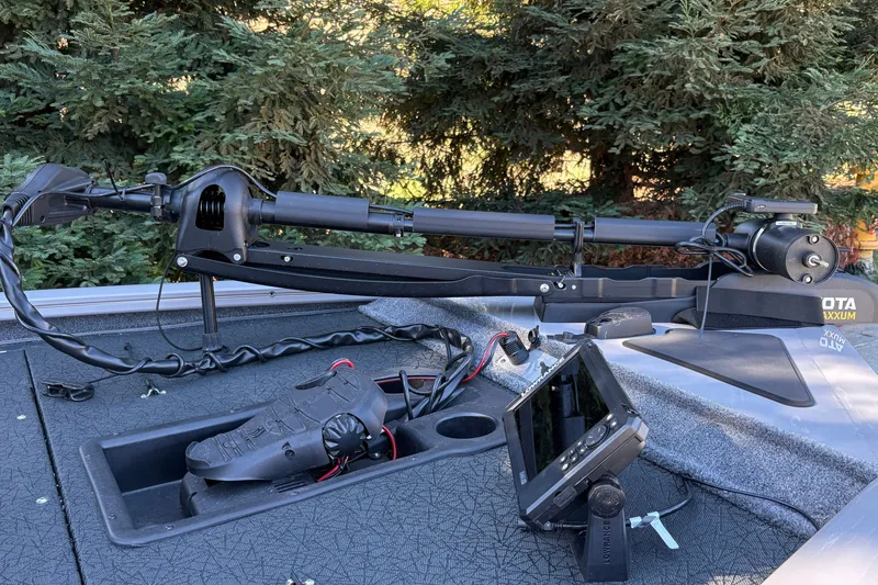 Slide: The Image of 2027 Tracker Pro Team 195 boat deck with trolling motor and fish finder. - 18