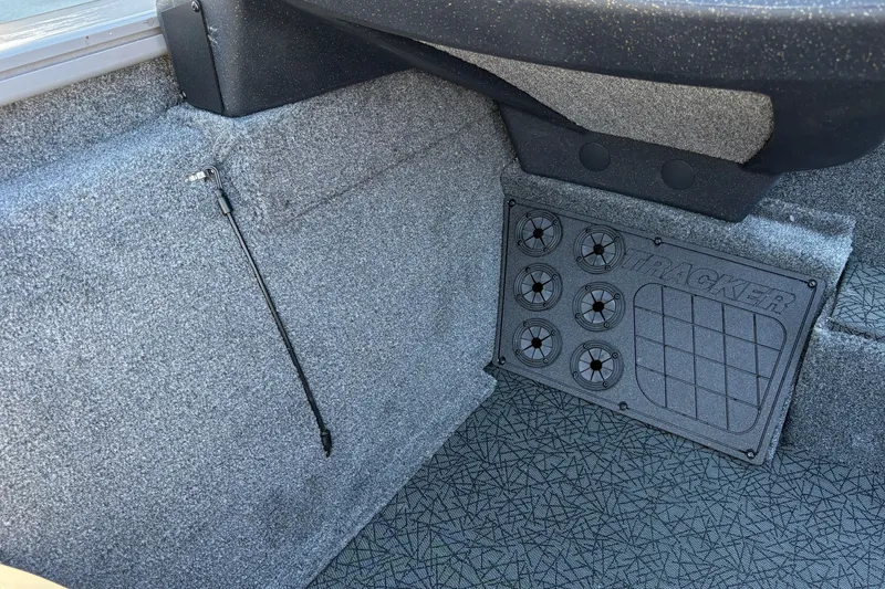Slide: The Image of Interior of 2027 Tracker Pro Team 195 boat with textured flooring and Tracker branding. - 23