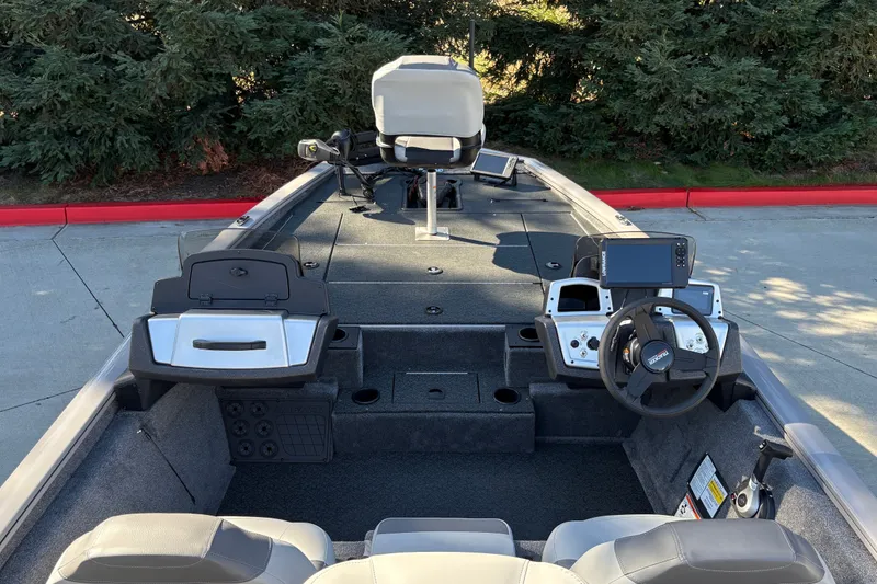 Slide: The Image of 2027 Tracker Pro Team 195 boat interior with steering wheel and control panel. - 22
