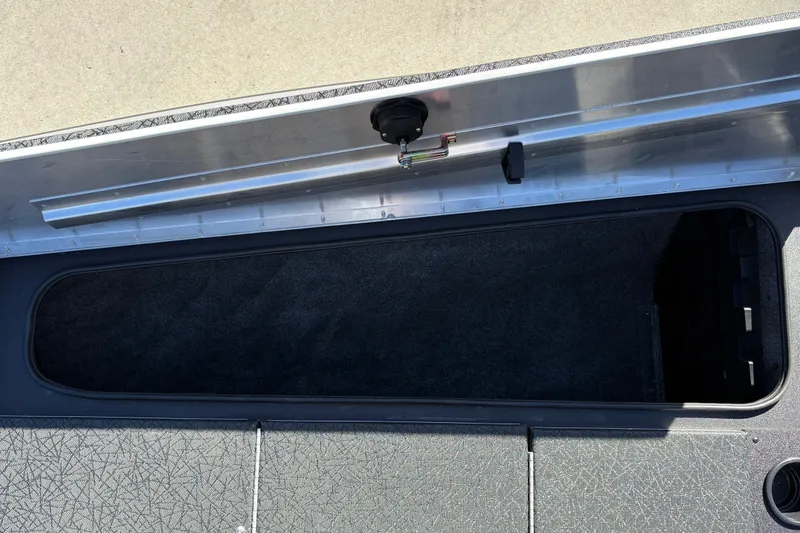 Slide: The Image of Open storage compartment on 2027 Tracker Pro Team 195 boat. - 33