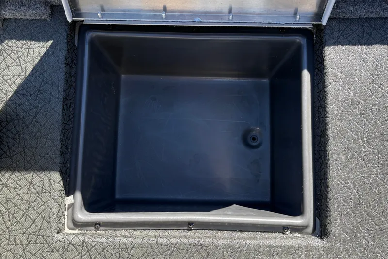 Slide: The Image of Open storage compartment in 2027 Tracker Pro Team 195 boat. - 41