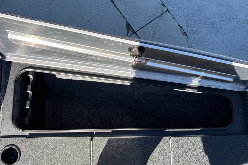 Slide: The Image of Open storage compartment in 2027 Tracker Pro Team 195 boat. - 34