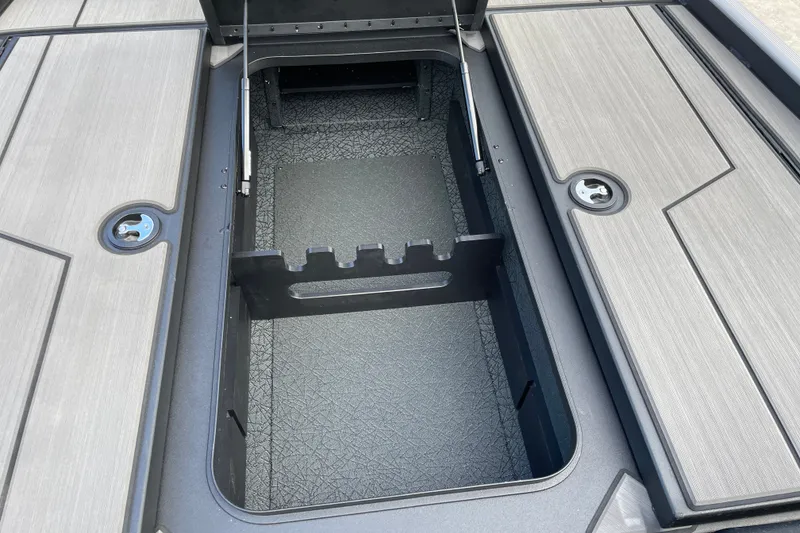 Slide: The Image of Open storage compartment on 2027 Tracker Pro 170 boat, featuring sleek design and secure latches. - 20