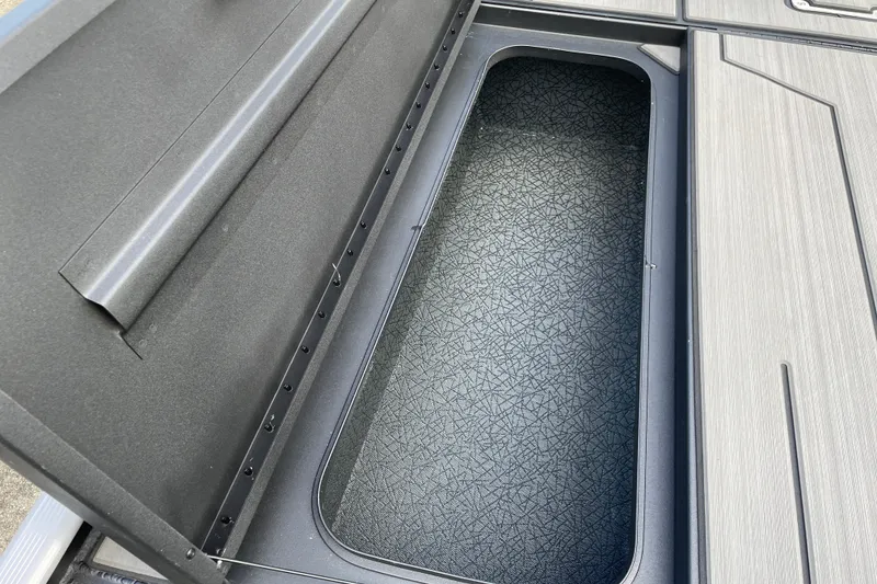 Slide: The Image of Open storage compartment in 2027 Tracker Pro 170 boat. - 19
