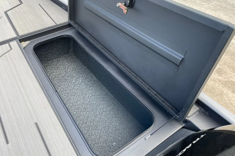 Slide: The Image of Open storage compartment on 2027 Tracker Pro 170 boat deck. - 21