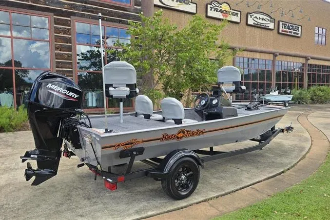 The Image of 2027 Tracker Bass Tracker Classic Limited boat with Mercury engine on display outdoors. - 0