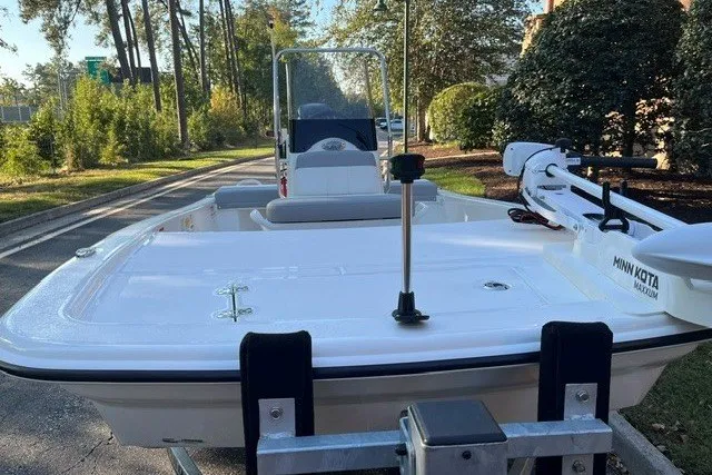 Slide: The Image of 2026 Mako Pro Skiff 13 CC boat on trailer, featuring Minn Kota trolling motor. - 3