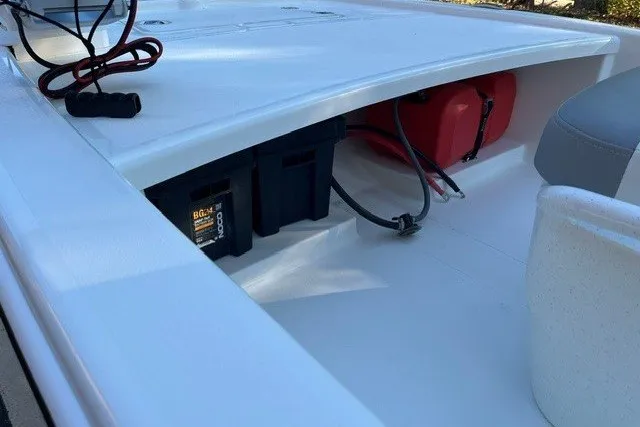 Slide: The Image of 2026 Mako Pro Skiff 13 CC interior showing battery and fuel storage compartments. - 9