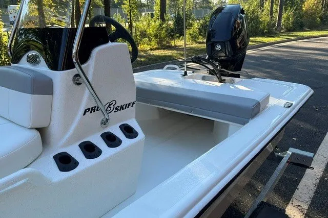 Slide: The Image of 2026 Mako Pro Skiff 13 CC boat with sleek design and modern outboard motor. - 13