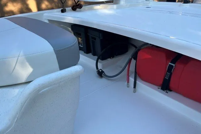 Slide: The Image of 2026 Mako Pro Skiff 13 CC interior with storage compartment and seating. - 6