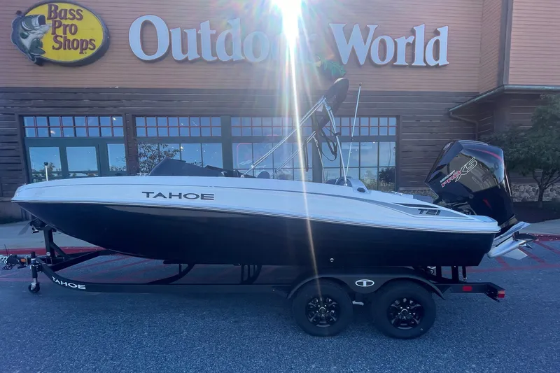 Slide: The Image of 2027 Tahoe T21 boat on trailer outside Bass Pro Shops Outdoor World. - 1