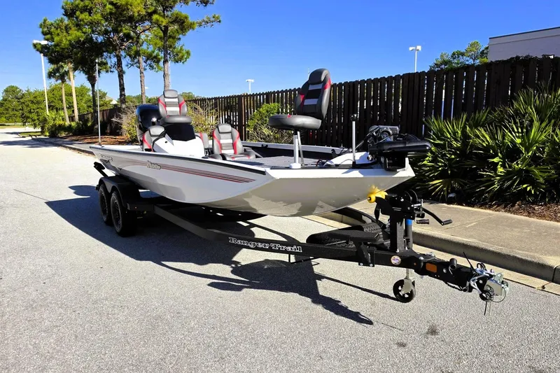 Slide: The Image of 2027 Ranger RT198P boat on trailer, parked on sunny street. - 8