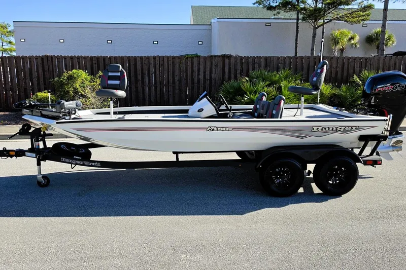 Slide: The Image of 2027 Ranger RT198P fishing boat on trailer, parked outdoors. - 9