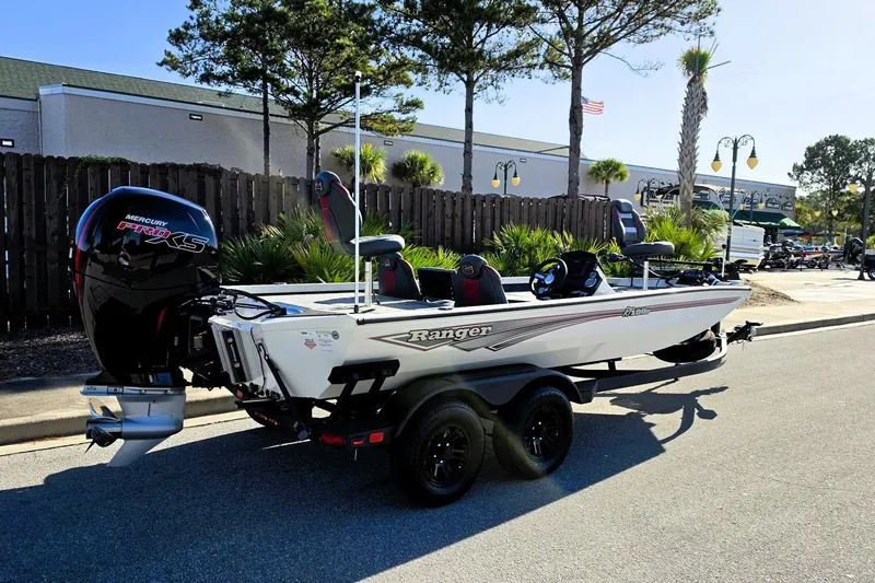 Slide: The Image of 2027 Ranger RT198P boat with Mercury Pro XS engine, parked outdoors. - 4