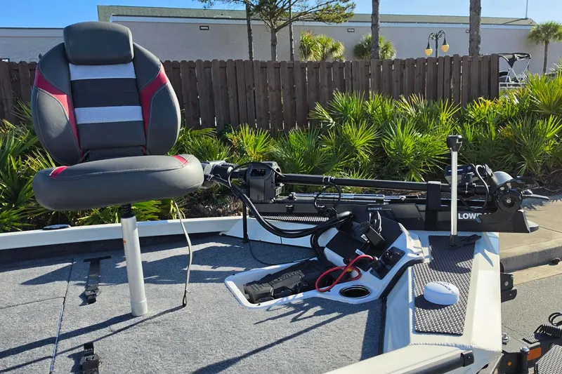 Slide: The Image of 2027 Ranger RT198P boat deck with seat and trolling motor in sunny setting. - 14