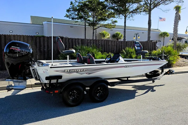 Slide: The Image of 2027 Ranger RT198P boat with Mercury Pro XS engine on trailer, parked outdoors. - 1