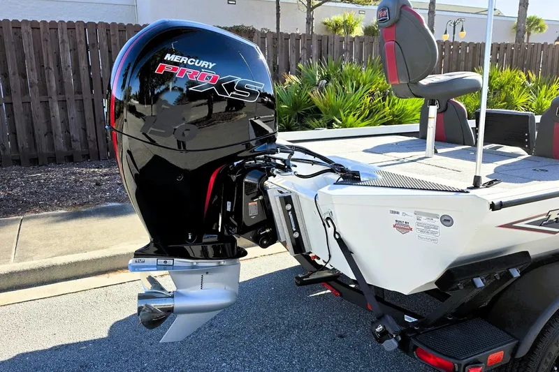 Slide: The Image of 2027 Ranger RT198P boat with Mercury Pro XS engine, parked outdoors. - 6