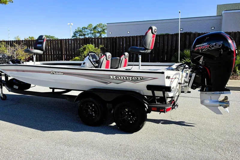 Slide: The Image of 2027 Ranger RT198P boat with Mercury Pro XS engine, parked outdoors. - 11