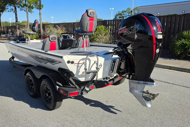 Slide: The Image of 2027 Ranger RT198P boat with Mercury Pro XS 150 engine, parked outdoors. - 12