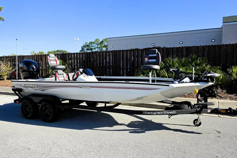 Slide: The Image of 2027 Ranger RT198P fishing boat on trailer, parked outdoors. - 7