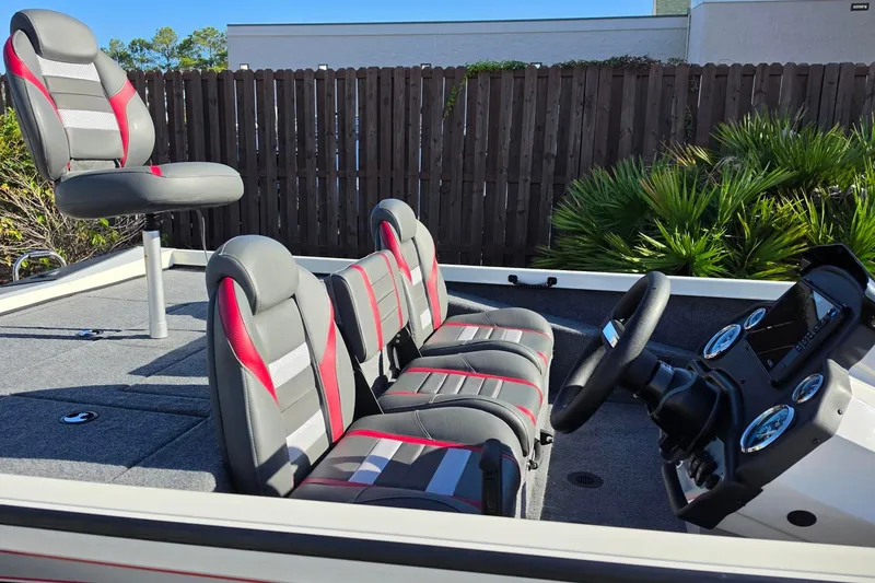 Slide: The Image of 2027 Ranger RT198P boat interior with modern seating and dashboard. - 16