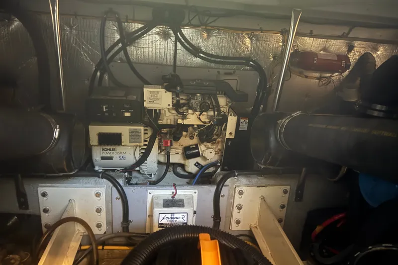 Slide: The Image of Engine room of a 2002 Silverton 410 Sport Bridge with Kohler power system. - 56