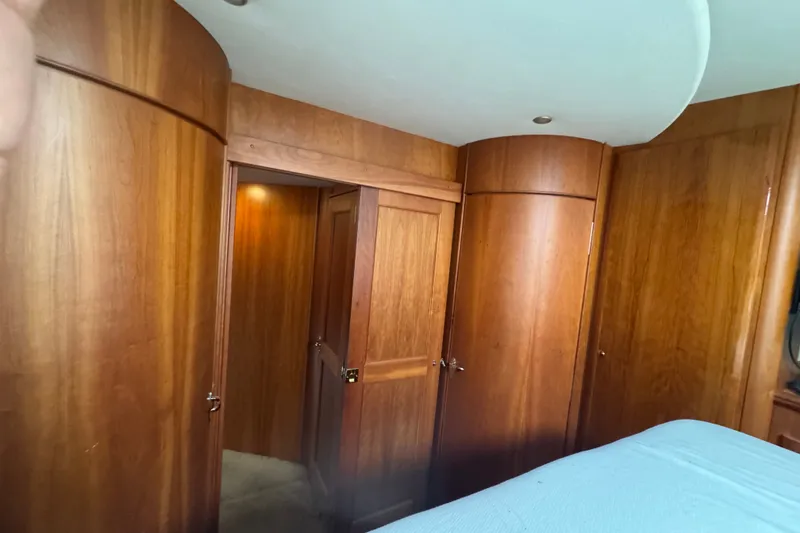 Slide: The Image of Interior of 2002 Silverton 410 Sport Bridge with wooden cabinetry and door. - 43
