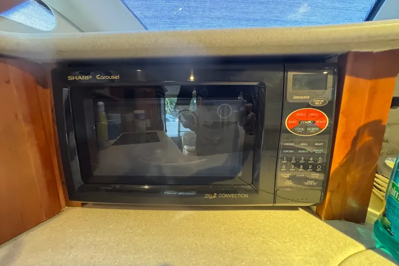 Slide: The Image of Sharp Carousel microwave in a 2002 Silverton 410 Sport Bridge yacht kitchen. - 37