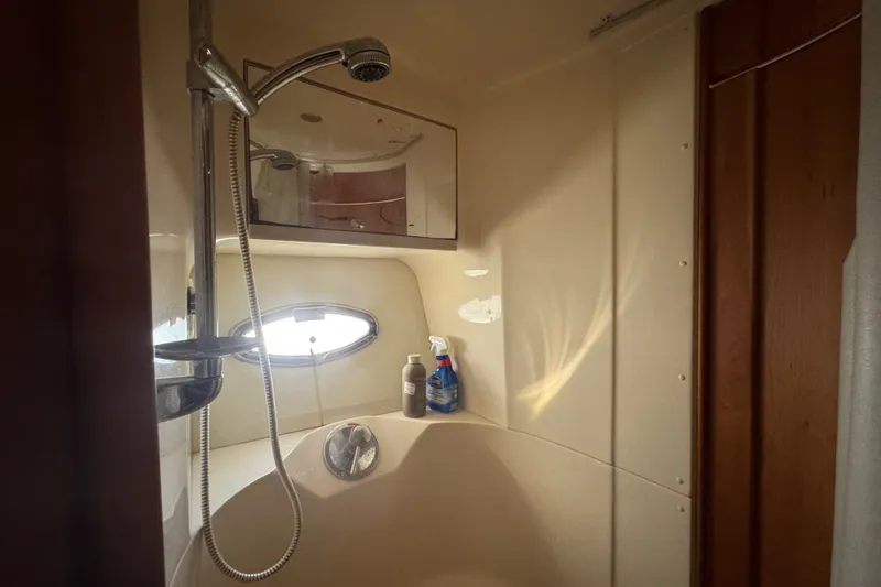 Slide: The Image of Shower area in a 2002 Silverton 410 Sport Bridge yacht bathroom. - 48