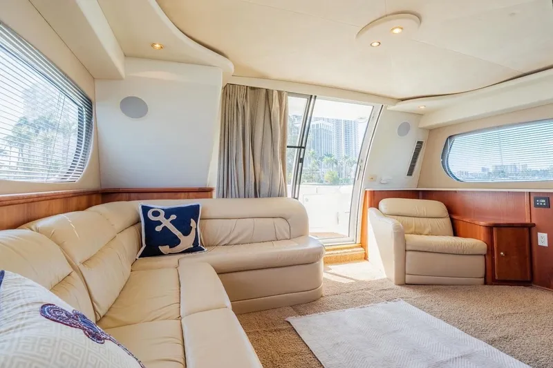 Slide: The Image of Luxurious interior of 2002 Silverton 410 Sport Bridge yacht with plush seating and nautical decor. - 15