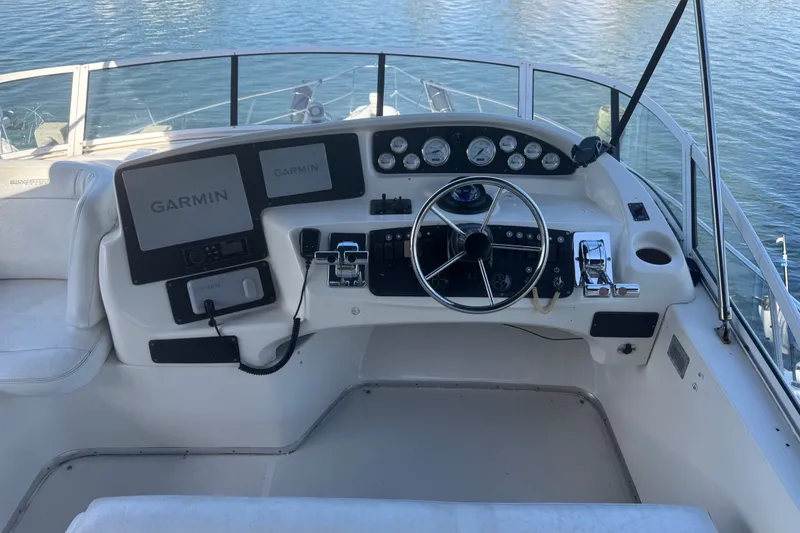 Slide: The Image of Cockpit of 2002 Silverton 410 Sport Bridge with Garmin navigation system. - 14