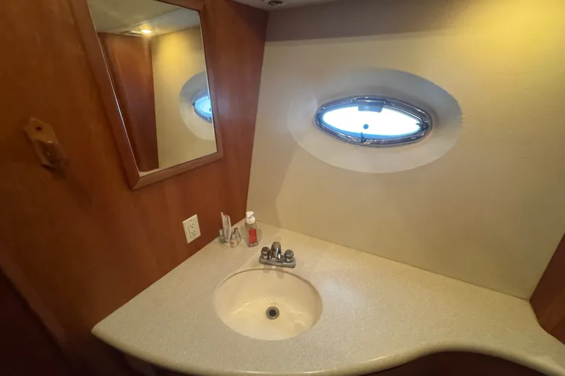Slide: The Image of Bathroom sink area in a 2002 Silverton 410 Sport Bridge yacht. - 46